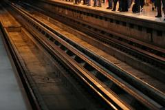 Interior view of Metro CDMX train with passengers seated and standing