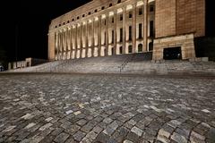 Eduskuntatalo parliament building in Helsinki illuminated at night