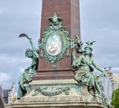 Base of Anspach Column at Quai au Bois à Brûler in Brussels with fountain and historic architecture