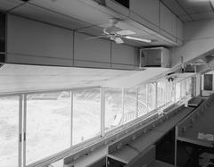 Abandoned Baltimore Memorial Stadium press box with decaying field visible through windows