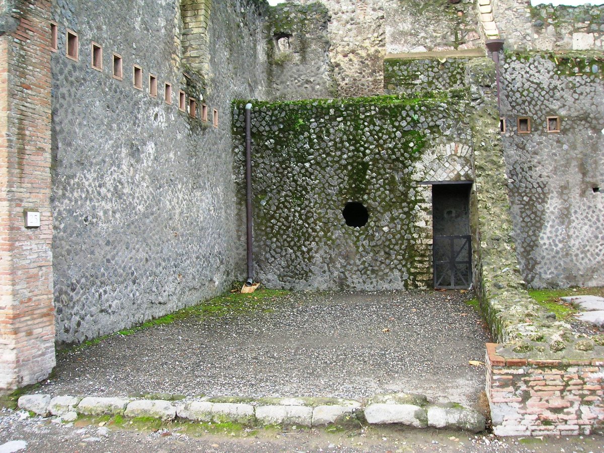 Photo of ancient shop in Pompeii Italy Vii.5.25