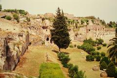 Ruins of ancient Pompeii city with preserved walls and archways under blue sky