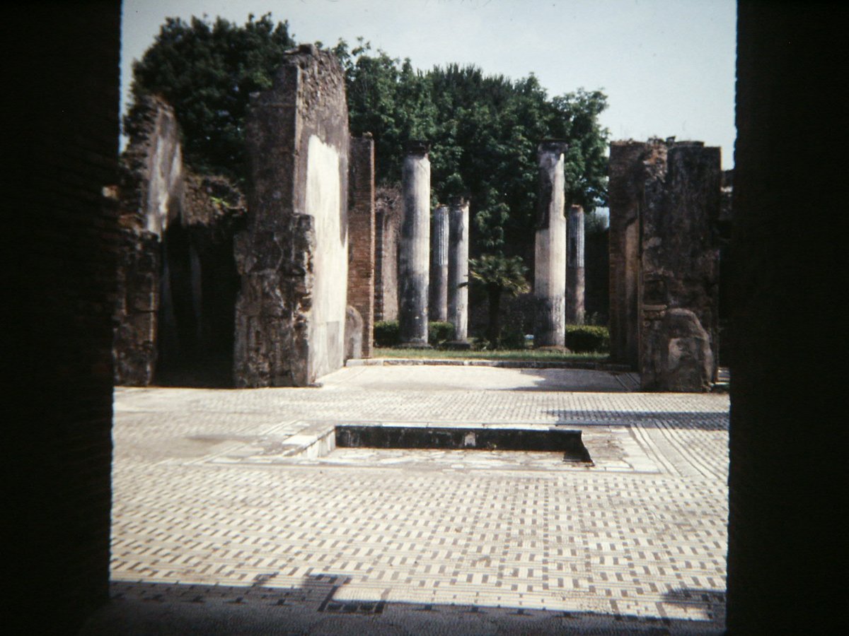 Ancient Roman house ruins with frescoes in Pompeii, Italy