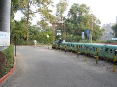Sayaji Baug Toy Train running on a narrow gauge track in a garden