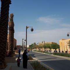 Main road in Diriyah with traditional buildings and clear sky