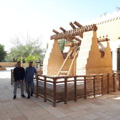 Reconstructed traditional well in Diriyah with stone structure and wooden elements