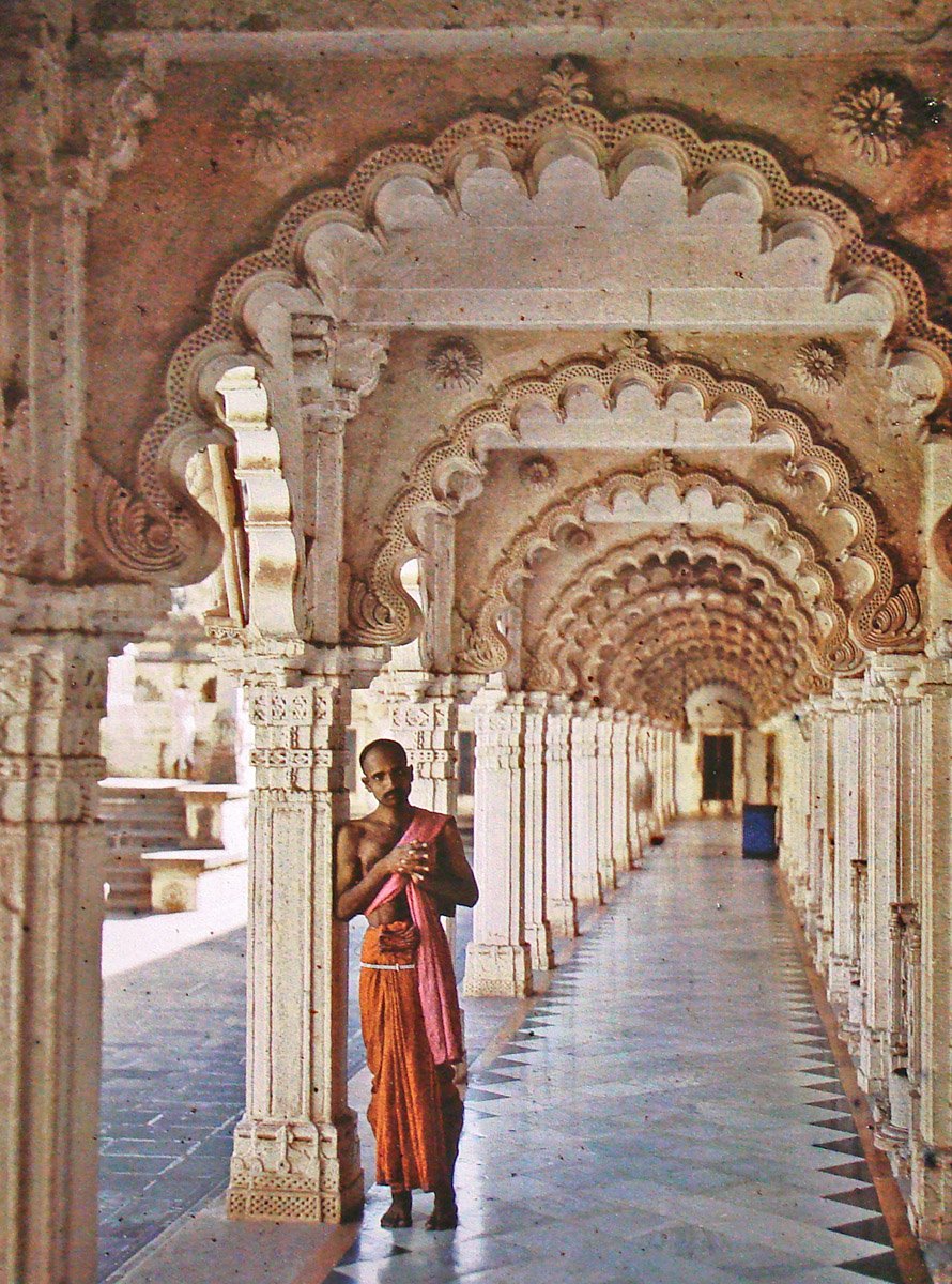 Portrait of a Jain priest in orange dhoti in Hathi Singh temple Ahmedabad 1913
