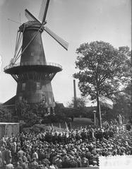 Folkloristic demonstration at Leidse Veemarkt near De Valk windmill with students in traditional attire celebrating student event