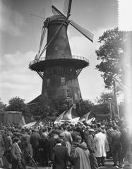 Folkloristic demonstration at Leidse Veemarkt near De Valk windmill with students celebrating in Leiden, June 1955