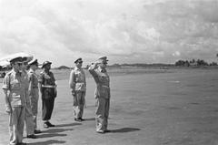 General H.J. Kruls giving a military salute at Kemajoraan airport upon arrival in Batavia, Indonesia, May 1, 1947