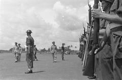 General H.J. Kruls inspecting the honor guard upon arrival at Kemajoran Airport, Batavia, Indonesia, May 1, 1947