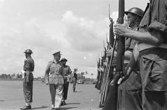 General H.J. Kruls inspecting honor guard at Kemajoran airport, Batavia, Indonesia, May 1, 1947