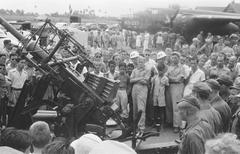 People observing anti-aircraft artillery at Kemajoran airfield in Batavia, Indonesia, March 9, 1947, black and white historical photo