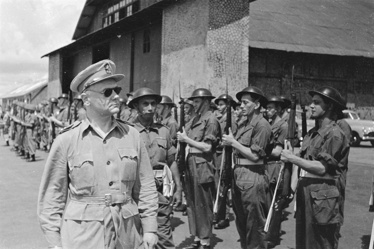 General H.J. Kruls inspects honor guard at Kemajoran airfield during arrival in Batavia, Indonesia, May 1, 1947