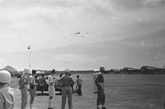 General H.J. Kruls' airplane landing at Kemajoraan airfield in Batavia escorted by three military Mustangs in 1947