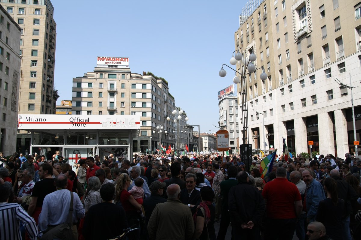 Liberation Day parade with flags and crowd in Milan on April 25, 2013