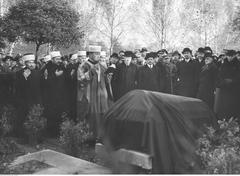 Mufti Jakub Szynkiewicz praying over the coffin at Powązki Military Cemetery during the transfer of socialist and independence activist Aleksander Sulkiewicz's ashes to Warsaw