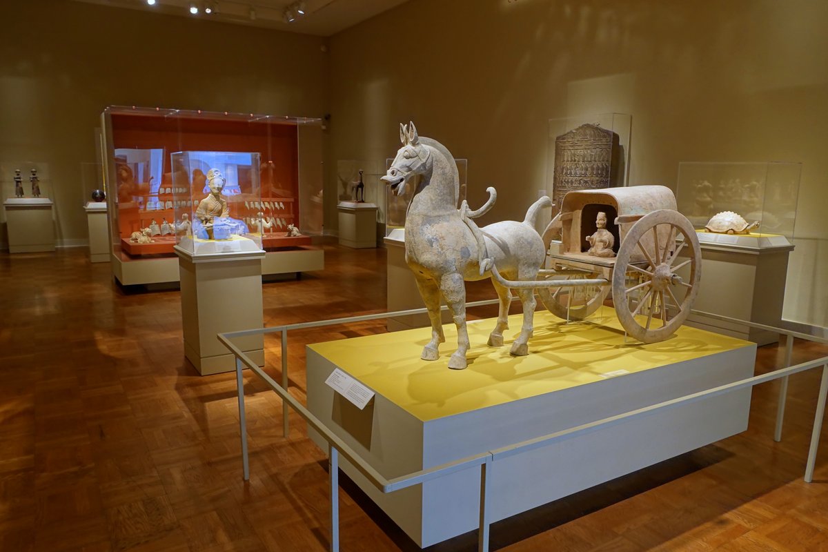 Interior view of Portland Art Museum with artwork displays and visitors in Portland Oregon