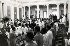 Ceremonial gathering at the Former Volksraad Building during the playing of the Dutch national anthem Wilhelmus for Queen Juliana's inauguration on September 6, 1948