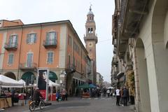 Santo Stefano Tower in Casale Monferrato, historic medieval brick tower under clear blue sky