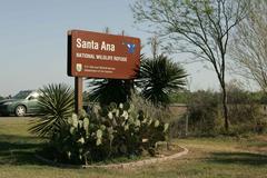 Santa Ana National Wildlife Refuge wooden sign surrounded by cacti plants