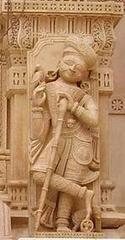 Dwarpal statue guarding temple entrance