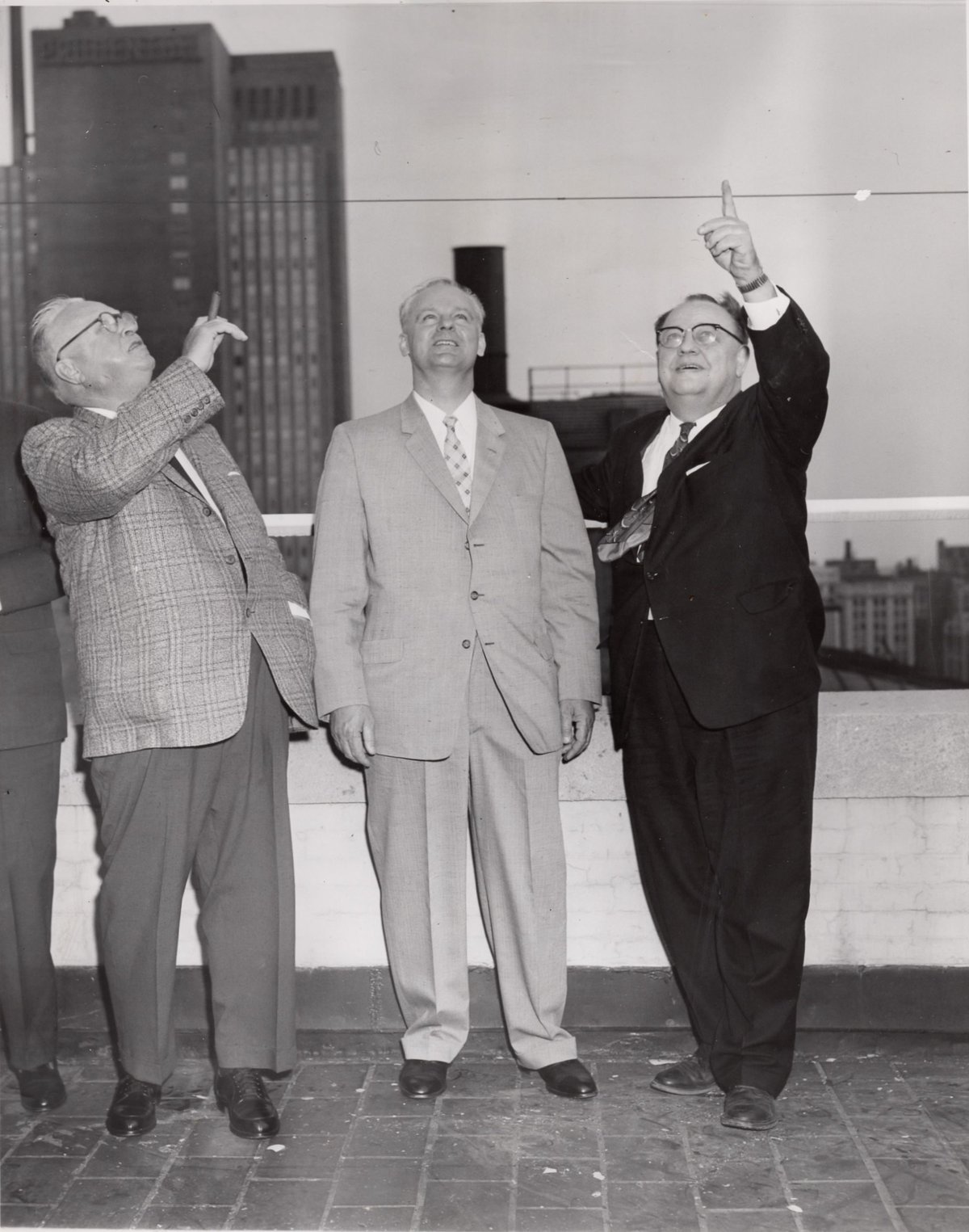 Roy A. Roberts, Mikhail Menshikov, and Milburn Pete Akers observing the cloudy Chicago sky for Sputnik 3, May 17, 1958