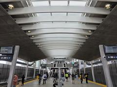 Platform at LAX Metro Transit Center on opening day with passengers and signage