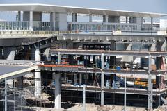 LAX Metro Transit Center station under construction in September 2023 with cranes and construction materials