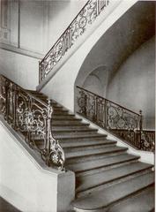 Interior staircase view of Palais Thurn und Taxis in Frankfurt with ornate architecture and chandeliers