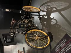 Antique three-wheeled vehicle Tricycle displayed in the Automobile Museum of Turin