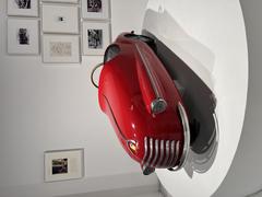 Vintage children's toy car on display at the Automobile Museum of Turin