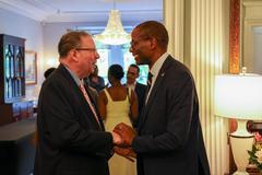 Juneteenth 2024 celebration at the United States Embassy in Canada with people gathered and American flags