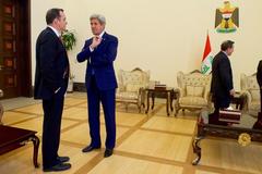 U.S. Secretary of State John Kerry shaking hands with Special Presidential Envoy Brett McGurk at U.S. Embassy Baghdad, April 8 2016