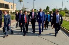 U.S. Secretary of State John Kerry walking with staff across U.S. Embassy Compound in Baghdad