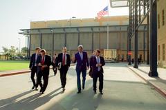 U.S. Secretary of State John Kerry walking with staff at U.S. Embassy Compound in Baghdad