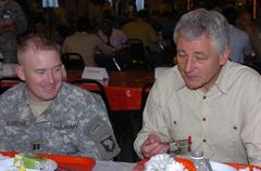 Nebraska Senator Chuck Hagel talking with Cpt. Jeffrey M. Vandyke at Baghdad Embassy Compound