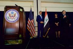 U.S. Ambassador Stuart Jones introducing U.S. Secretary of State John Kerry at the U.S. Embassy in Baghdad in 2016