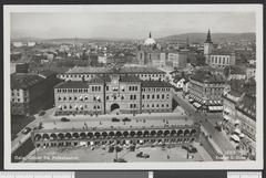 View of Youngstorget square in Oslo with surrounding buildings and street activity