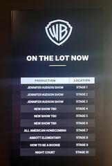 Warner Bros. Studio Tour Hollywood entrance with iconic signage and greenery in July 2023
