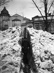 Historic black and white photo of snow piling in front of Vanha Ylioppilastalo building