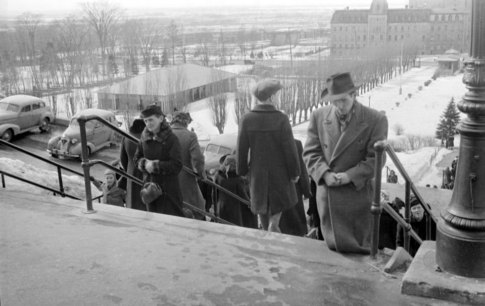 Pilgrims climbing stairs on knees at St. Joseph's Oratory Montreal