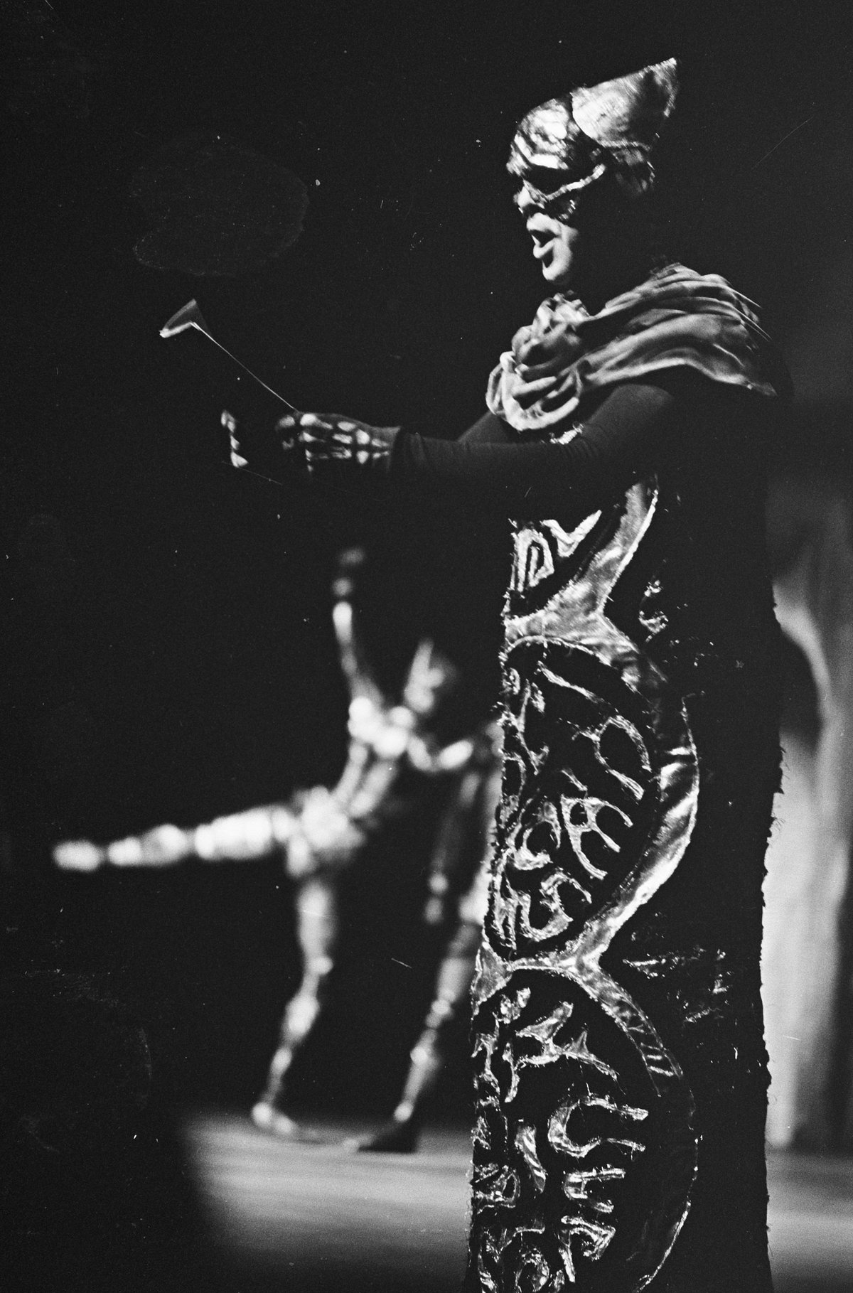 Black and white photo of ballet performance with narrator Renato Capecchi on right and dancer Maria Bovet on left