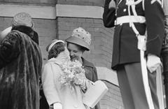 Princess Marijke whispering to Princess Margriet in Circus Scheveningen, The Hague, 1962 black and white photo
