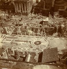 Black and white photograph of ancient Roman columns from the Vestal House in the Roman Forum