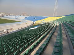 Al-Shaab Stadium aerial view with football field and seating areas