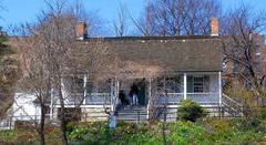 View of Dyckman House across Broadway on a sunny midday