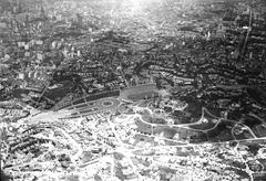 Aerial view of São Paulo cityscape with dense buildings and mountains in the background