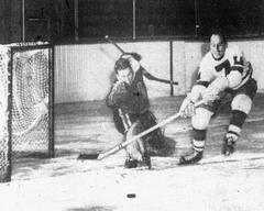 Oakland Oaks goalie Bev Bentley blocks shot by Los Angeles Monarch center Harry Black Nov 12 1947