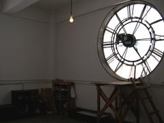 Inside view of the clock tower at Okuma Auditorium, Waseda University showing large 2-meter diameter clock faces